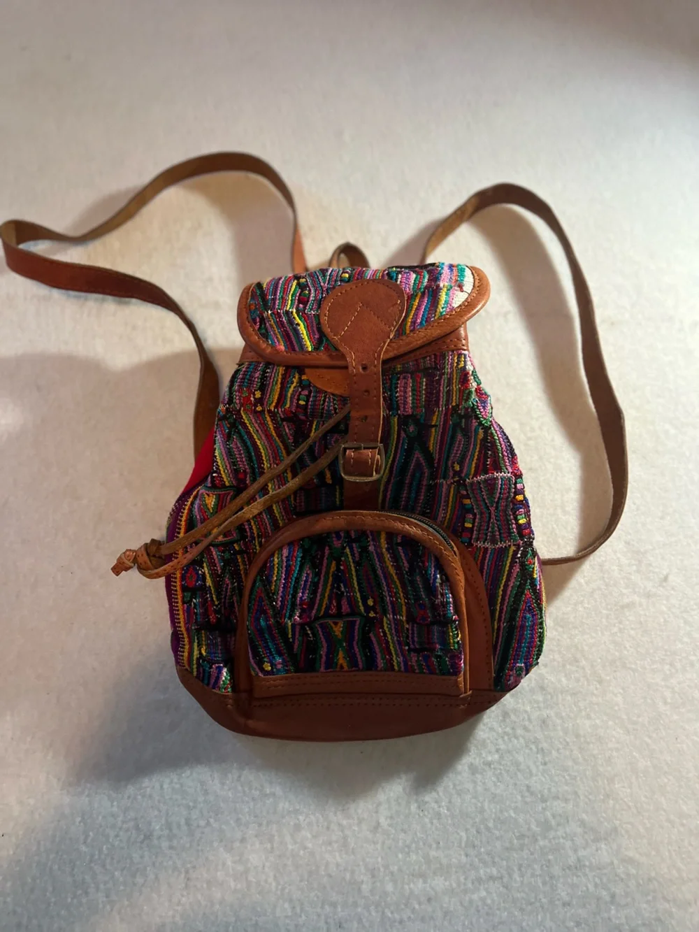 Multicolor Woven Drawstring Backpack with Tan Leather Trim